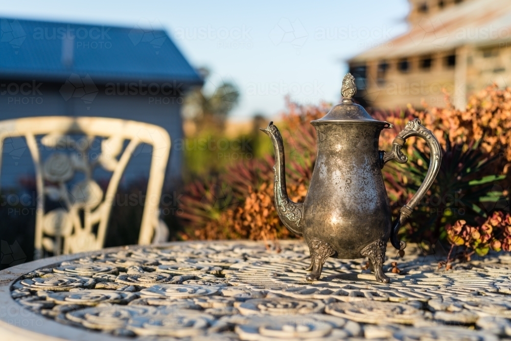 garden quirky decor, old silver teapot - Australian Stock Image