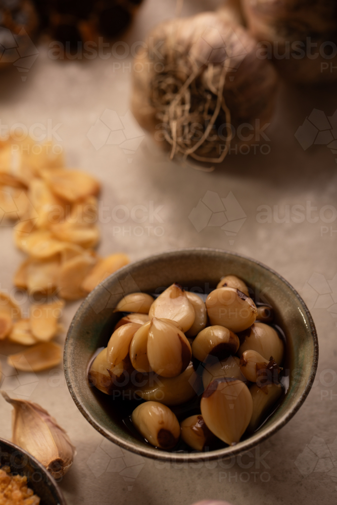 Garlic bulb with cloves and garlic chips - Australian Stock Image