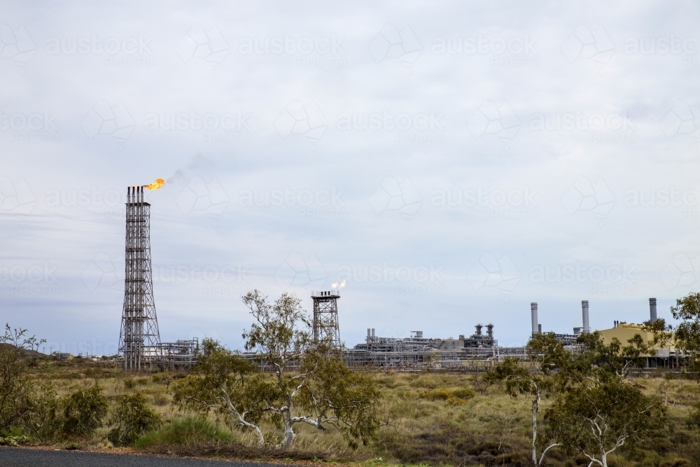 Gas plant with flames at top of tower - Australian Stock Image