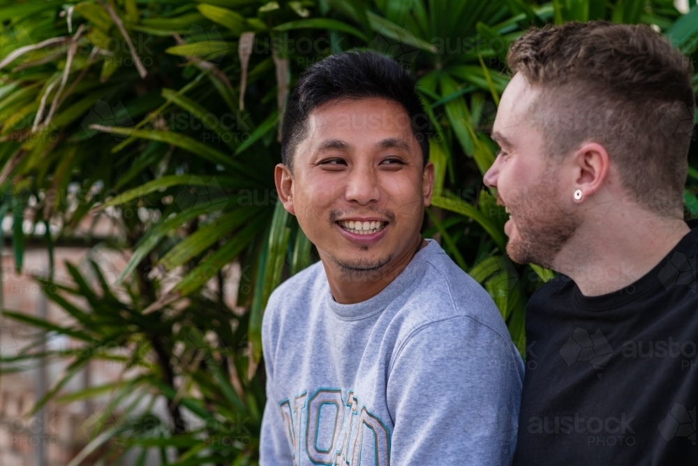 gay boyfriends talking - Australian Stock Image