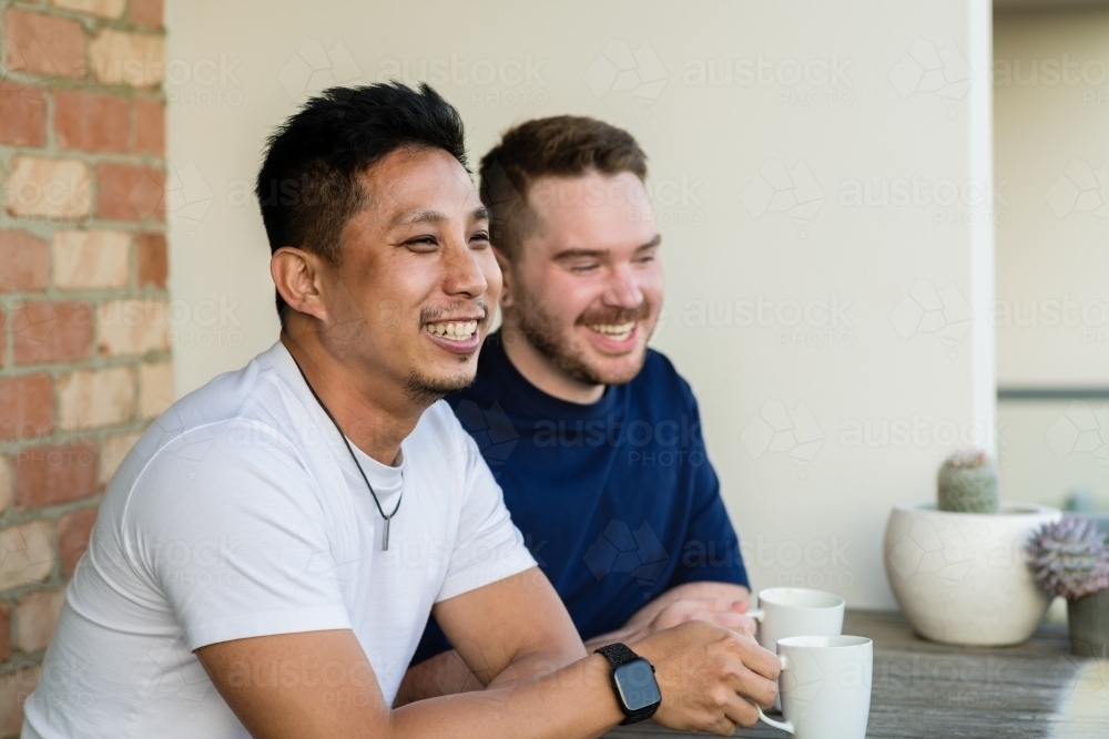 gay couple having a coffee - Australian Stock Image