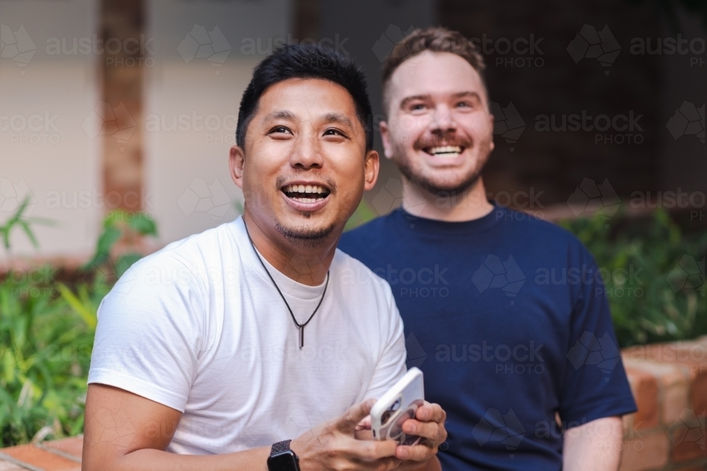 gay men laughing - Australian Stock Image