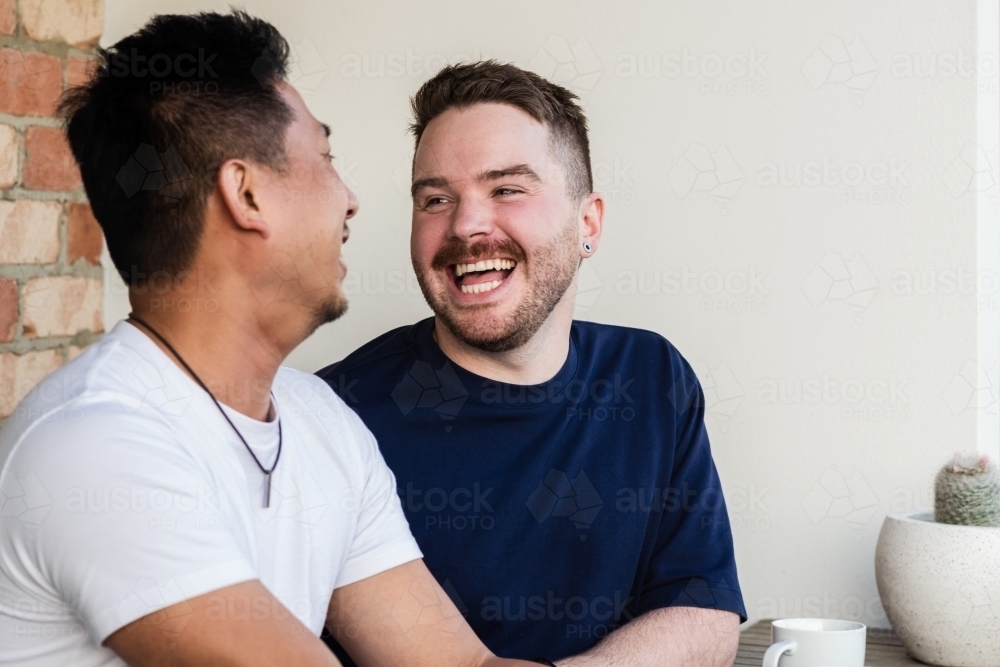 gay men laughing - Australian Stock Image