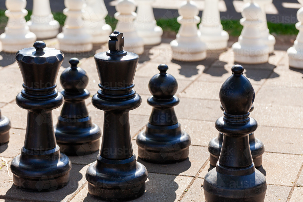 Giant chess game in sunlight ready to play - Australian Stock Image