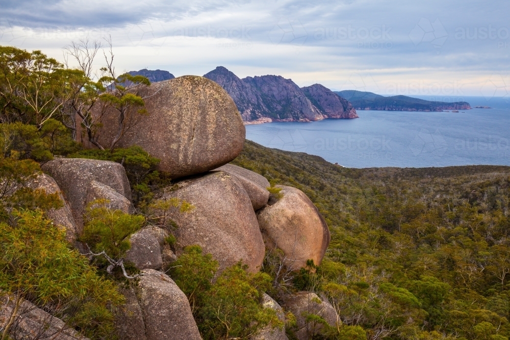 Giant granite boulders and The Hazards - Freycinet National Park - Tasmania - Australian Stock Image