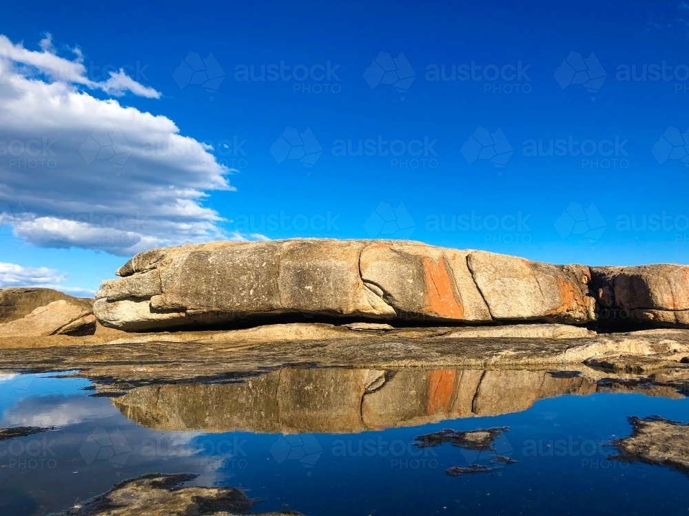 Giant rock reflection - Australian Stock Image