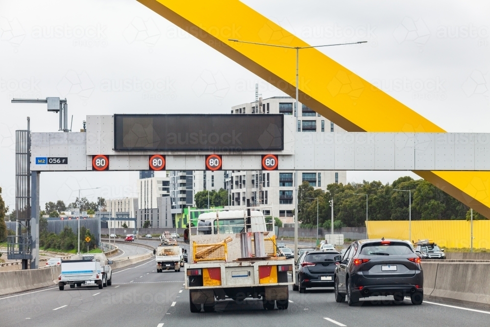 giant yellow sculpture over road in Melbourne - Australian Stock Image
