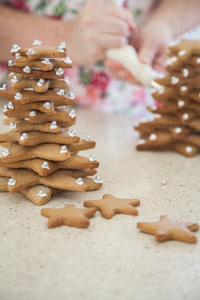 Gingerbread Christmas trees made with star biscuits - Australian Stock Image