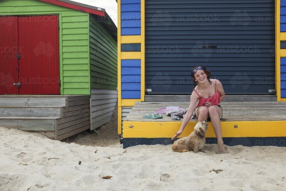 Girl at colourful beachbox - Australian Stock Image