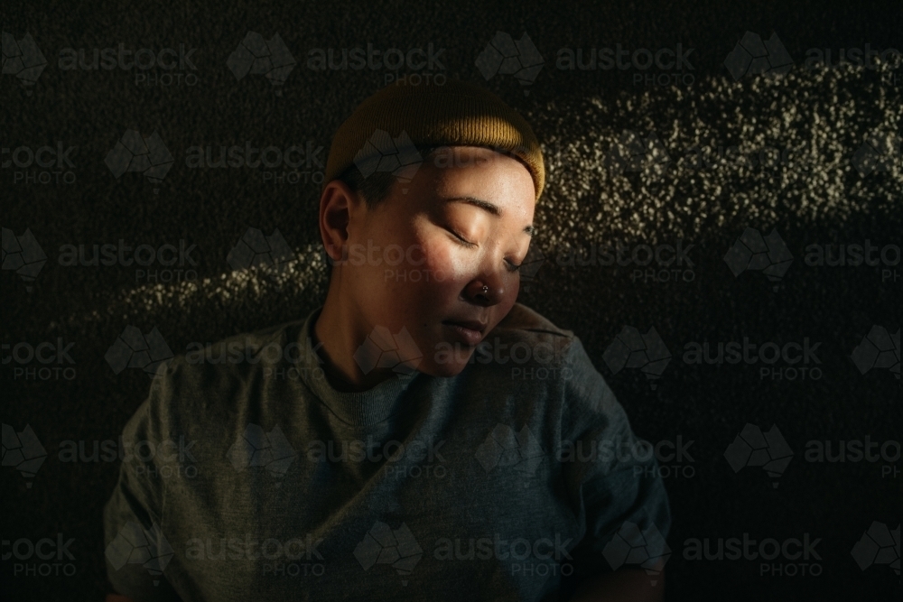 Girl basking in sunlight - Australian Stock Image