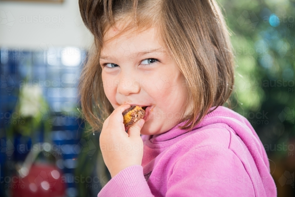 Girl enjoys home cooked treat - Australian Stock Image