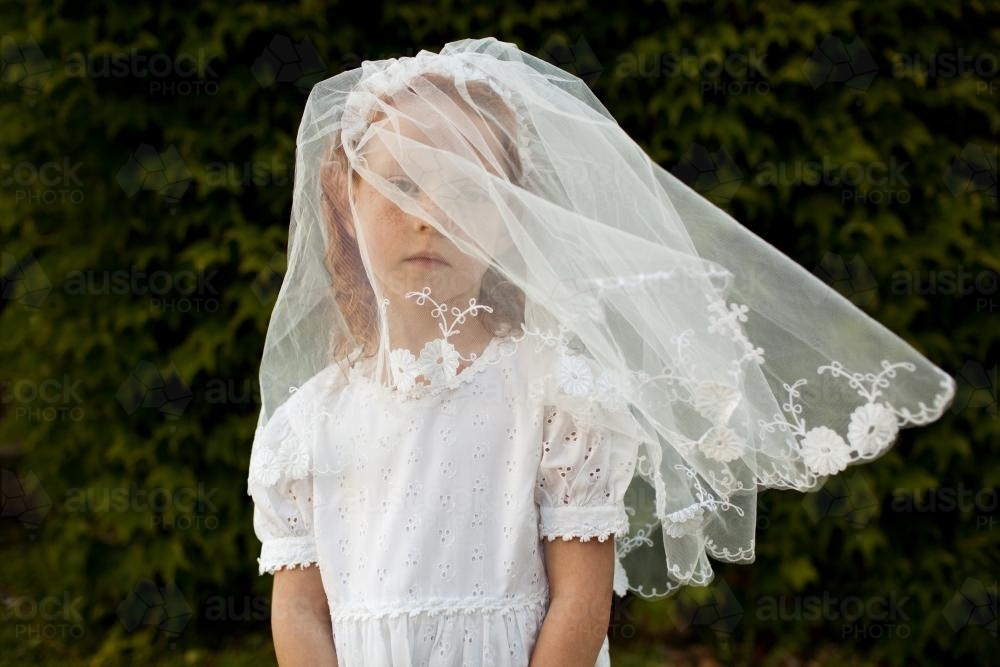 Girl in a communion veil - Australian Stock Image