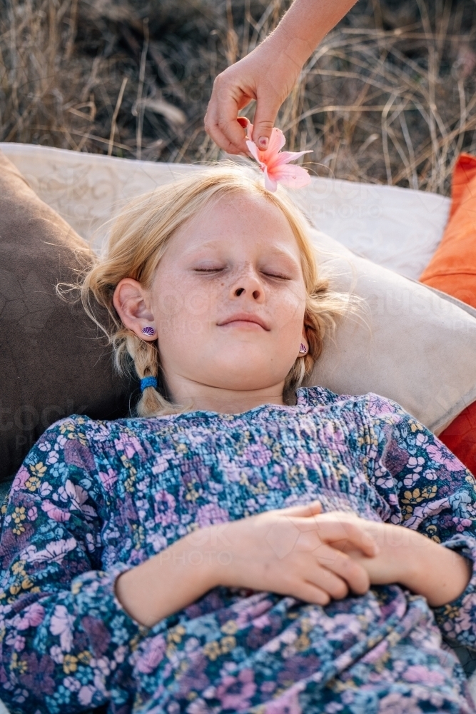 Girl laying down relaxing - Australian Stock Image