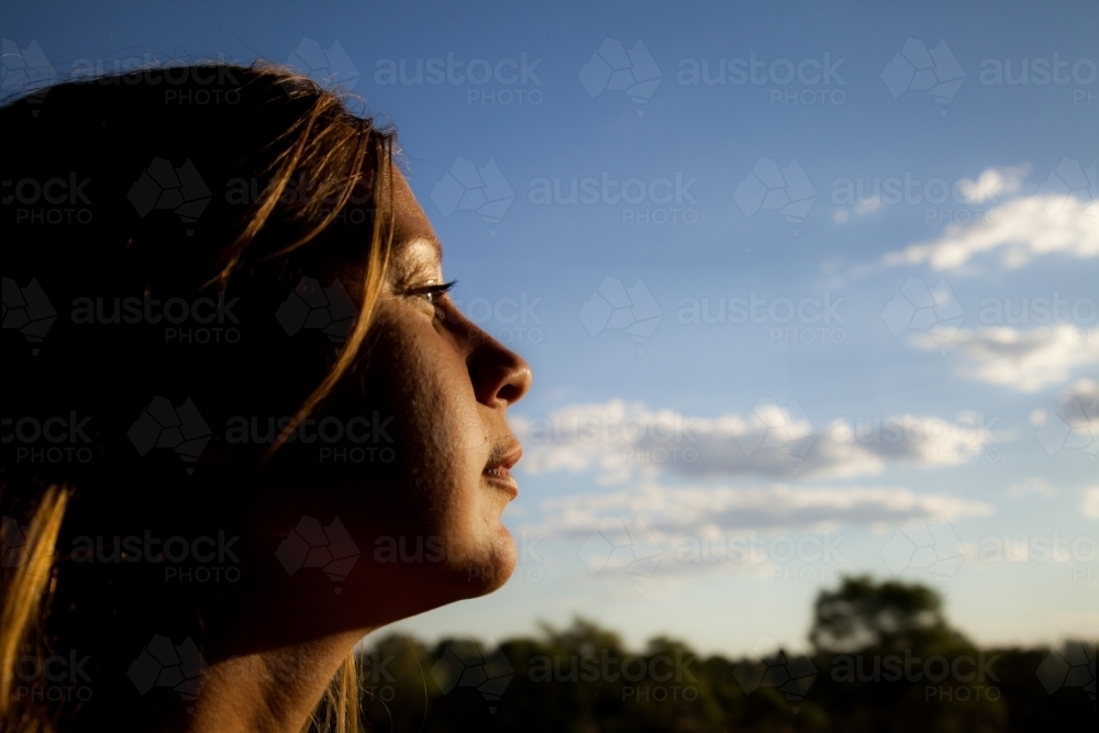 Girl looking at the sky - Australian Stock Image