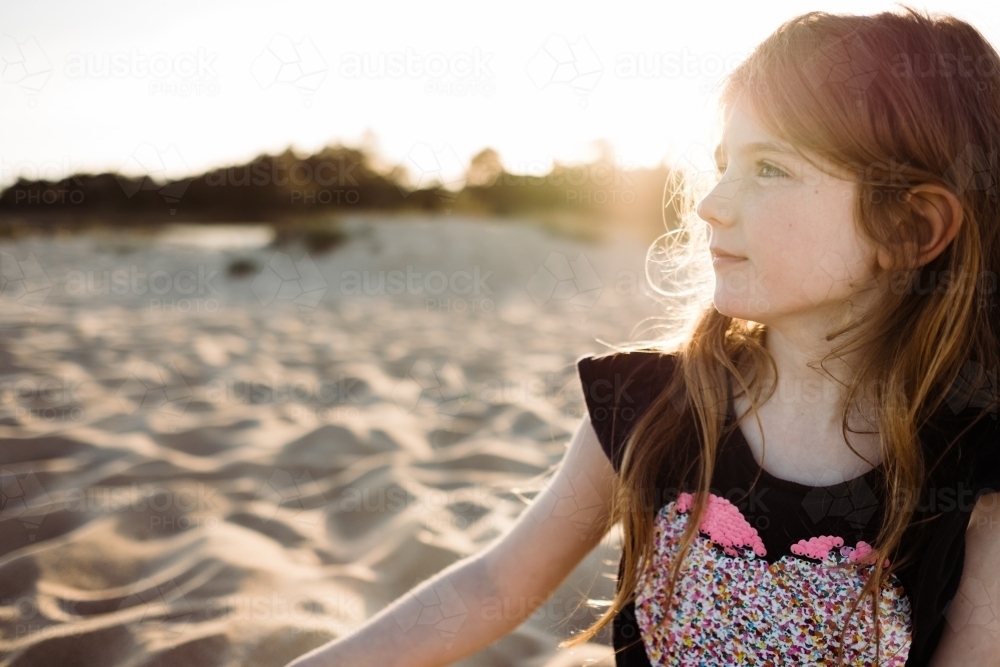 girl looking away at beach - Australian Stock Image