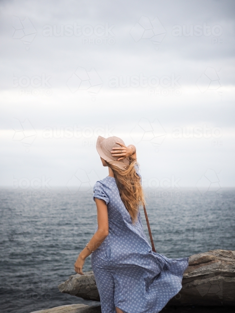 Girl looking out to ocean - Australian Stock Image