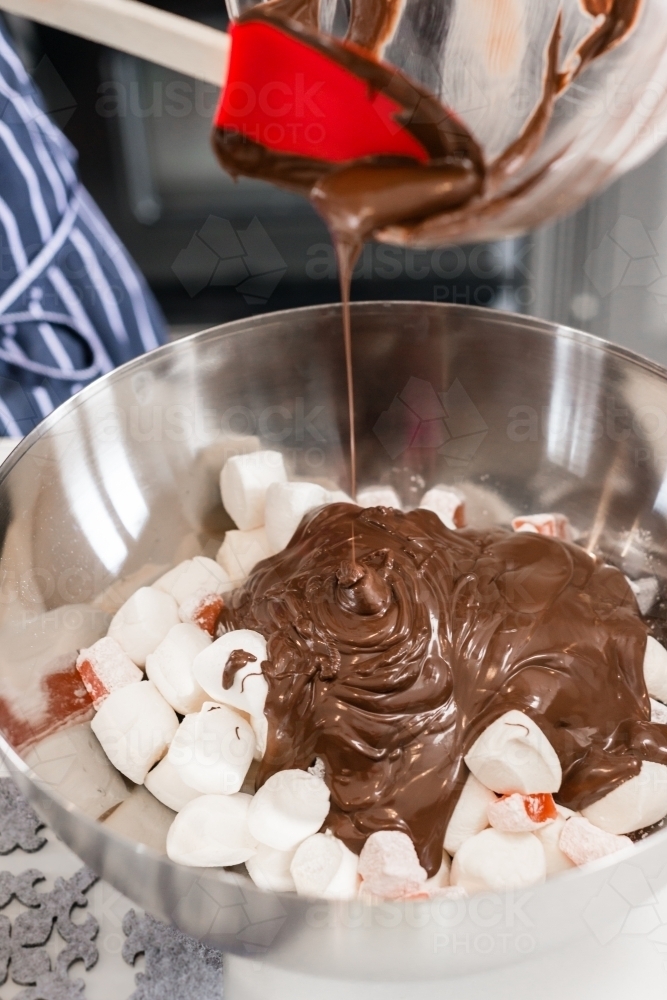 girl making chocolate dessert in the kitchen - Australian Stock Image