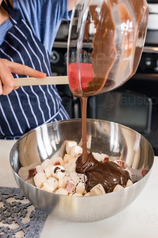 girl making chocolate dessert in the kitchen - Australian Stock Image