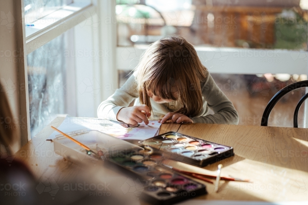Girl painting with watercolour - Australian Stock Image