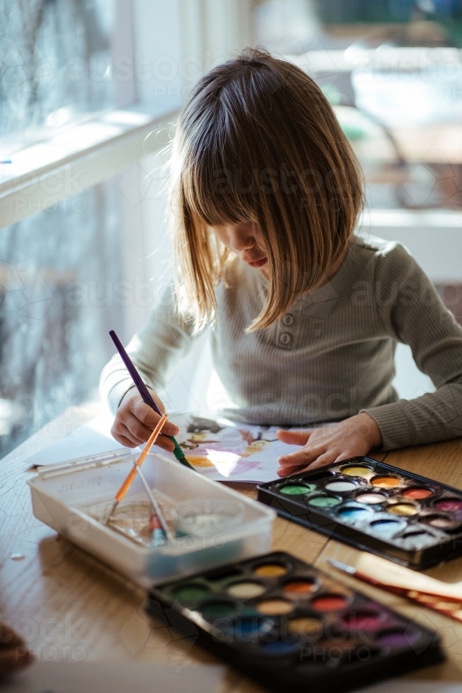 Girl painting with watercolour - Australian Stock Image