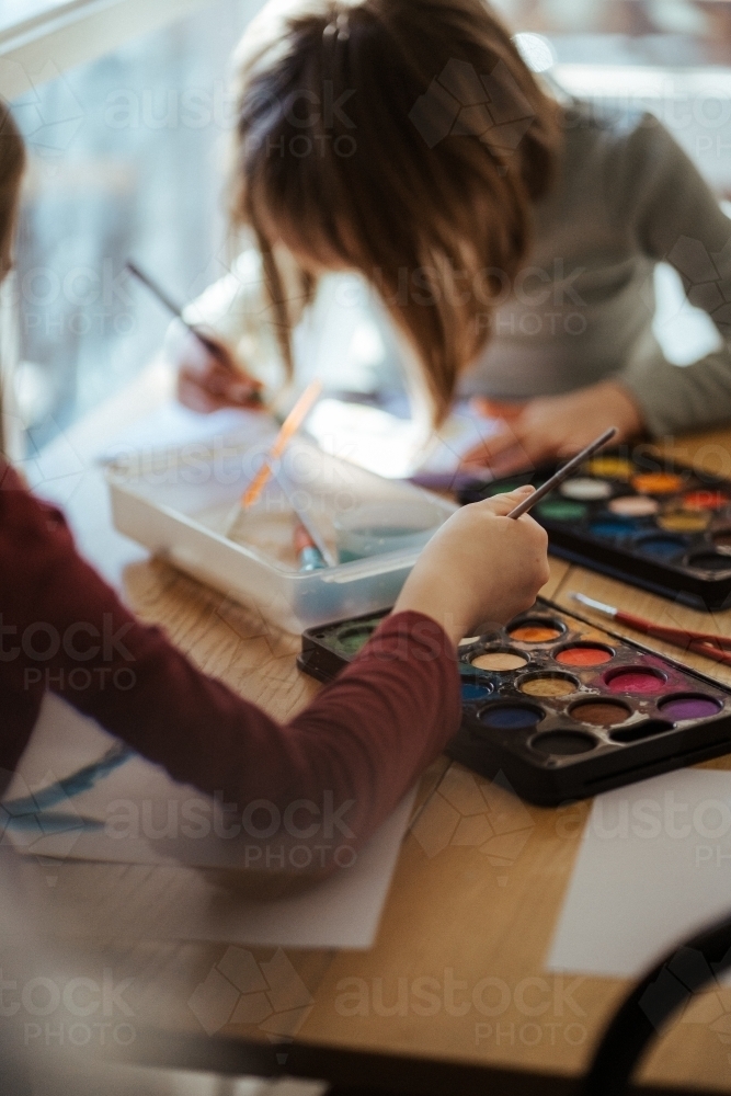 Girl painting with watercolour - Australian Stock Image
