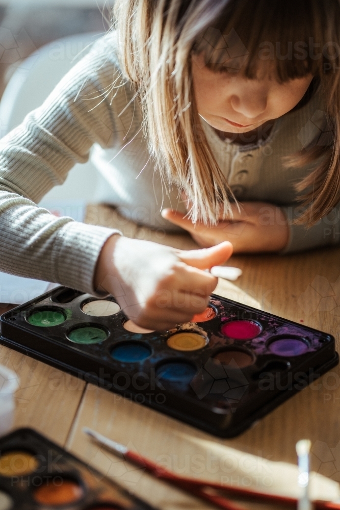 Girl painting with watercolour - Australian Stock Image