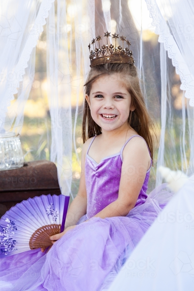 Girl playing dress ups as a princess - Australian Stock Image