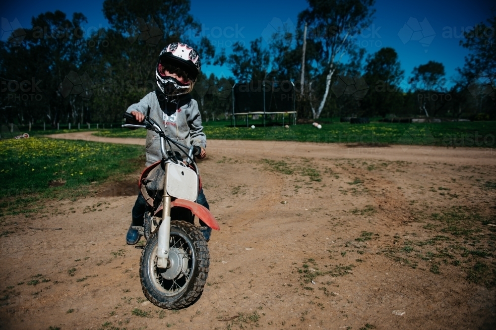 Girl ready to ride motorbike - Australian Stock Image