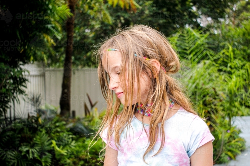 Girl smiling while facing on the left - Australian Stock Image
