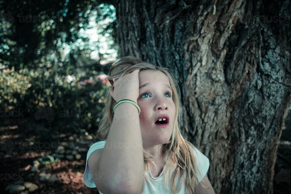Girl upset outdoors - Australian Stock Image