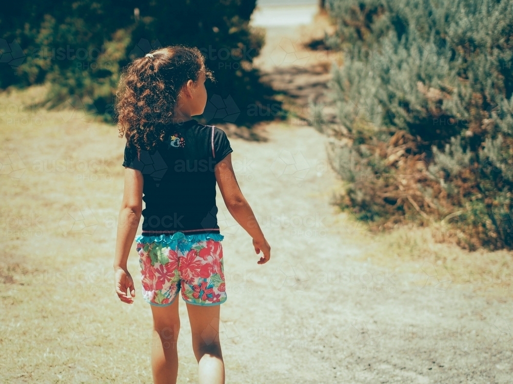 Girl walking at the beach - Australian Stock Image
