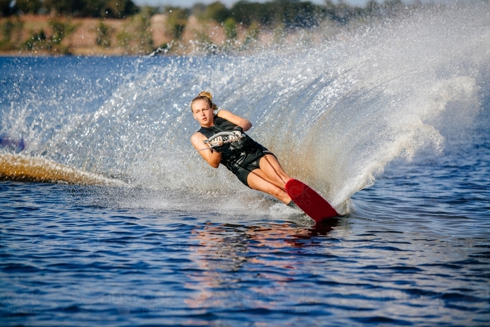 Girl water skiing on lake - Australian Stock Image