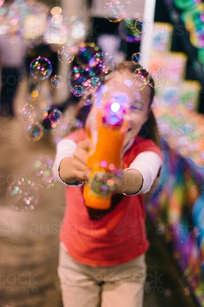 girl with bubble machine, abstract and blurr - Australian Stock Image