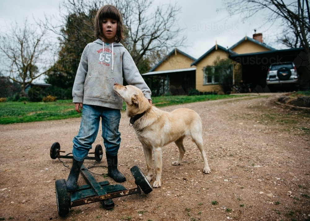 Girl with her dog & billy cart - Australian Stock Image
