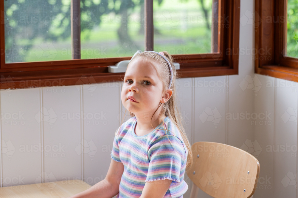 Girl with speech disability caused by lymphatic malformation genetic condition at speech pathology - Australian Stock Image