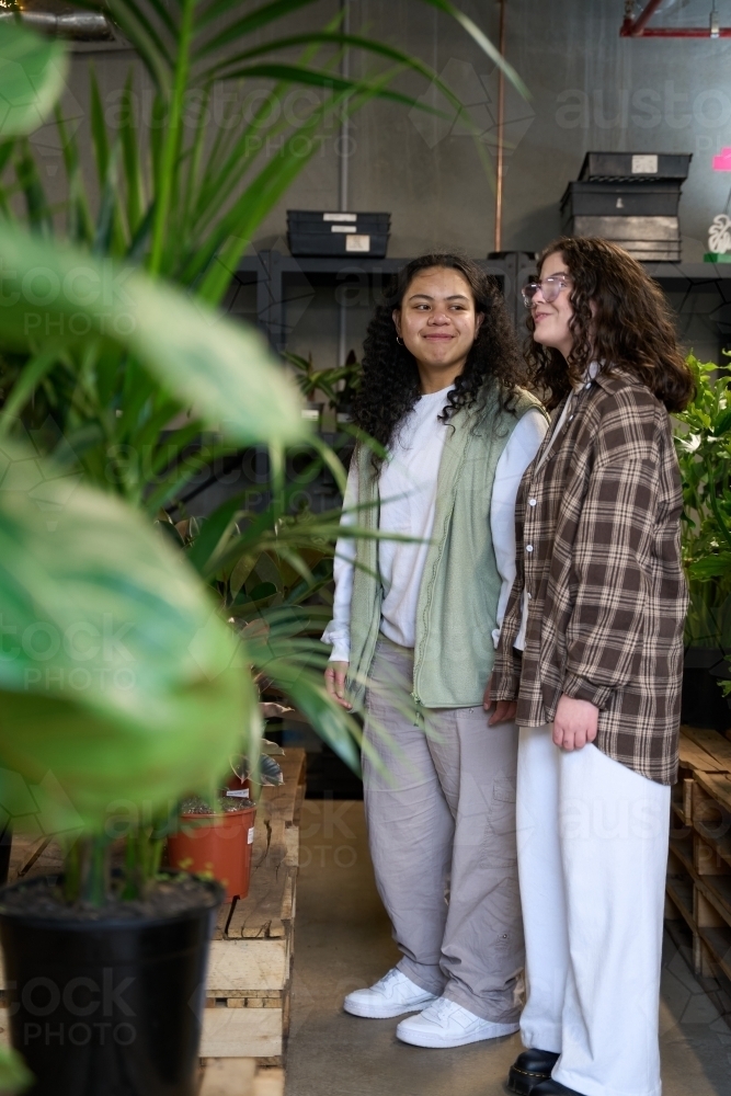 Girlfriends shopping for houseplants together - Australian Stock Image