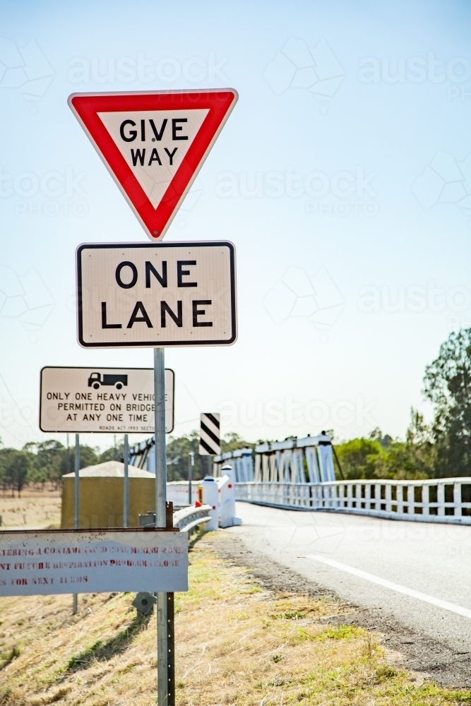 Give way, one lane road sign before Bulga Bridge - Australian Stock Image