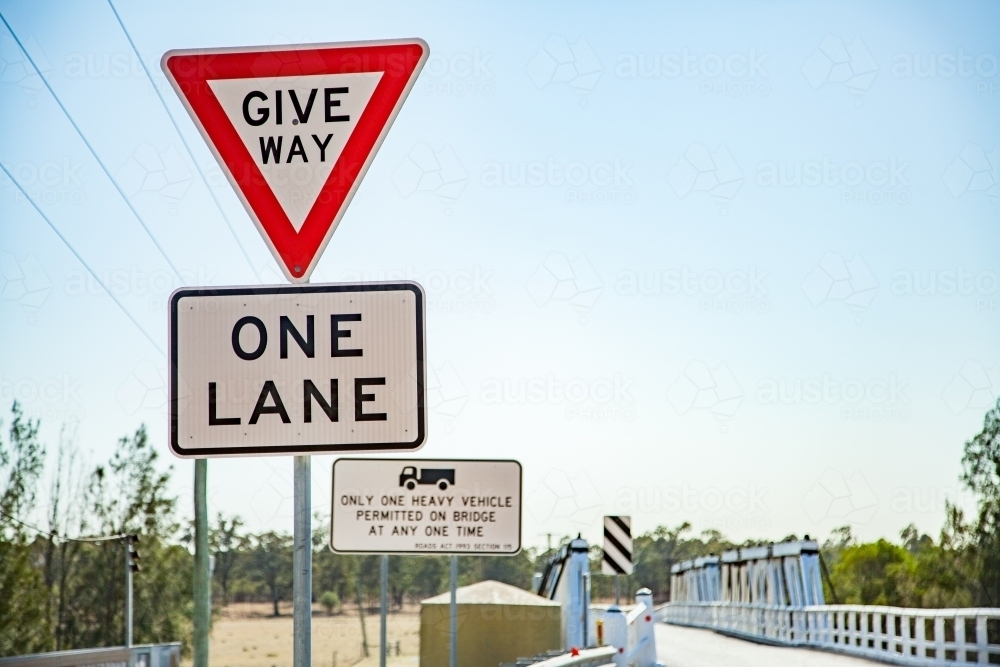 Give way one lane road sign before Bulga Bridge - Australian Stock Image