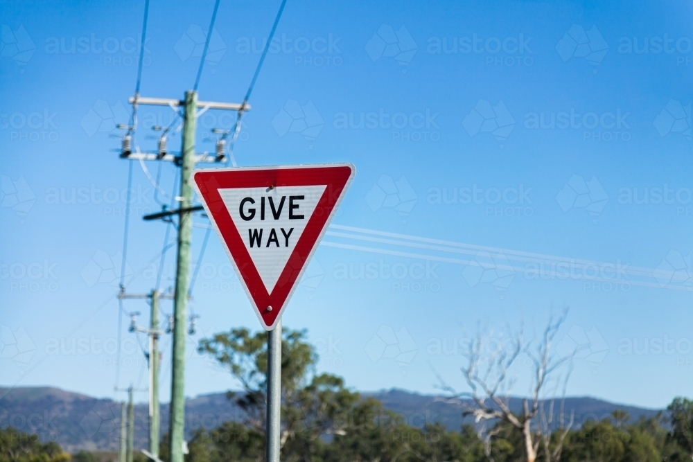 Image of Give Way sign on post with copy space Austockphoto