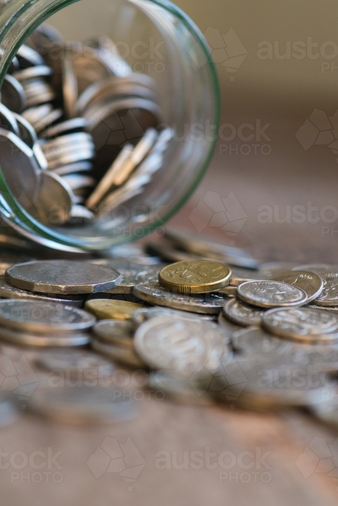 glass jar filled with Australian money - Australian Stock Image