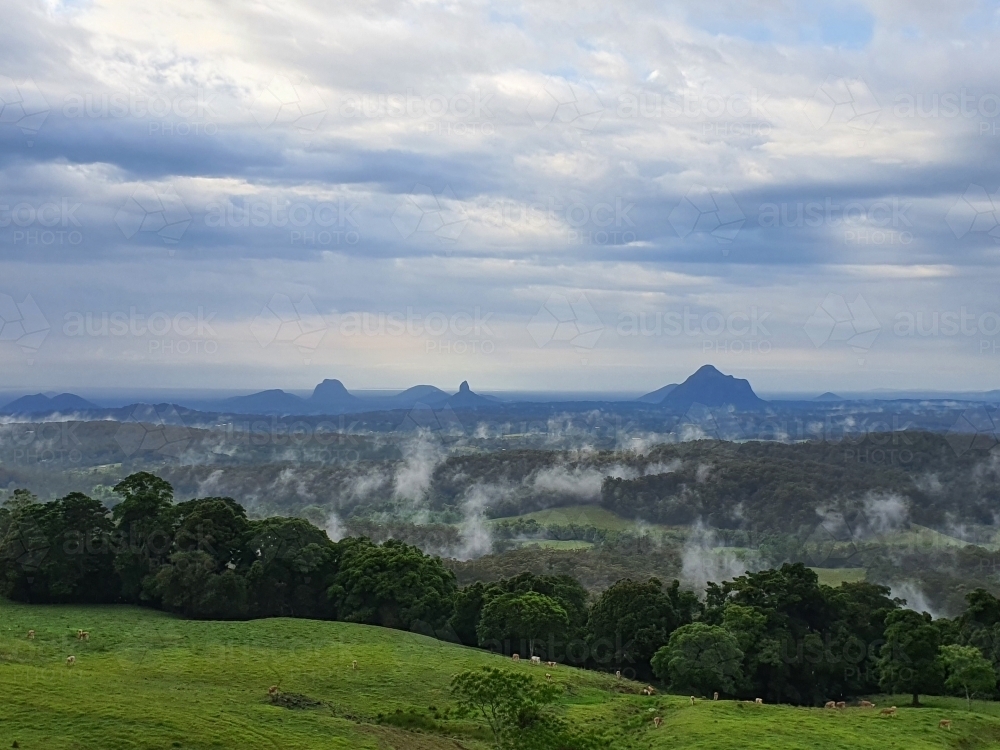 Glasshouse Mountains on a cloudy morning - Australian Stock Image
