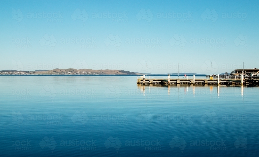 Glassy blue water in harbour - Australian Stock Image