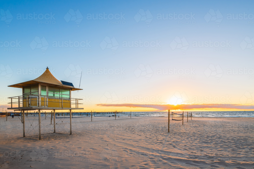 Glenelg Beach Surf life saving tower at sunset - Australian Stock Image