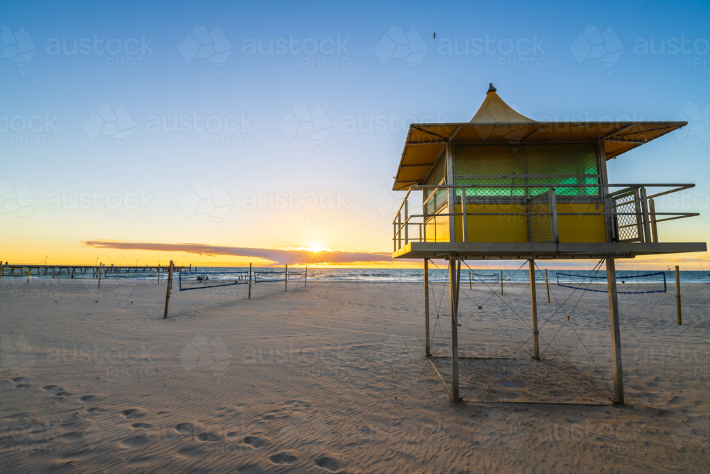 Glenelg Beach Surf life saving tower at sunset, South Australia - Australian Stock Image