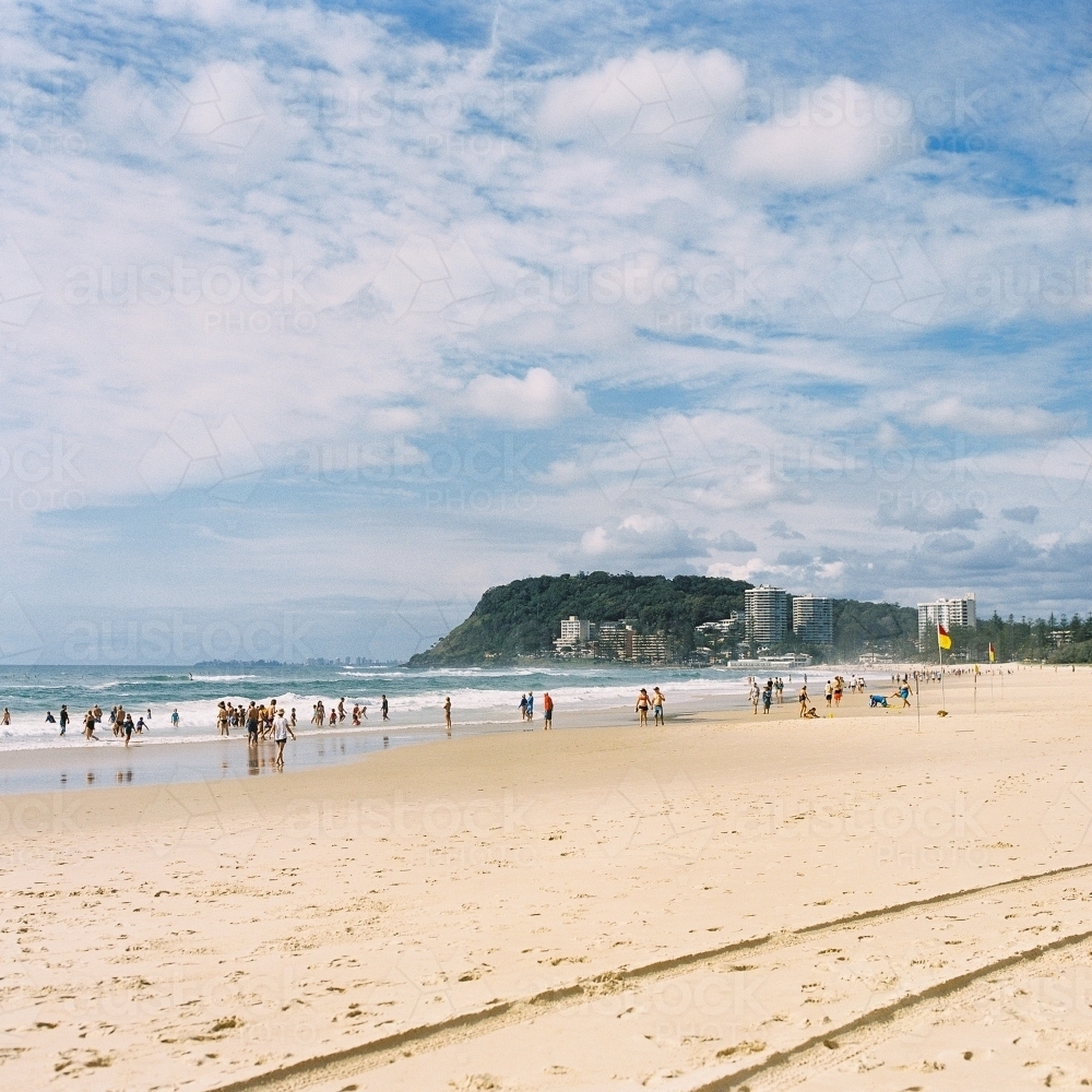 Gold Coast Beach with People and headland in the Distance - Australian Stock Image