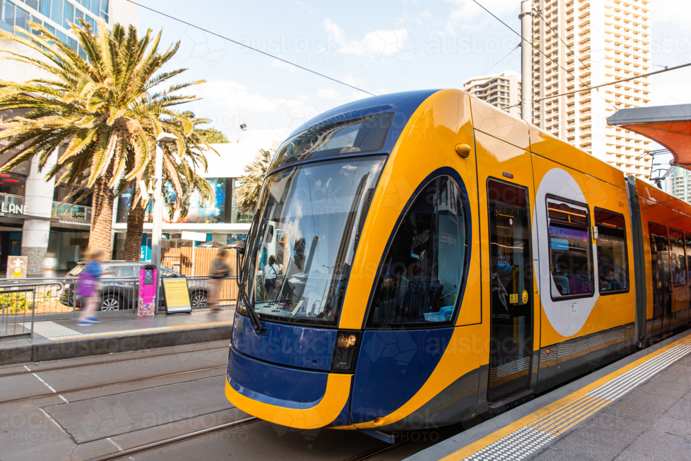 Gold Coast tram stopped at a platform - Australian Stock Image