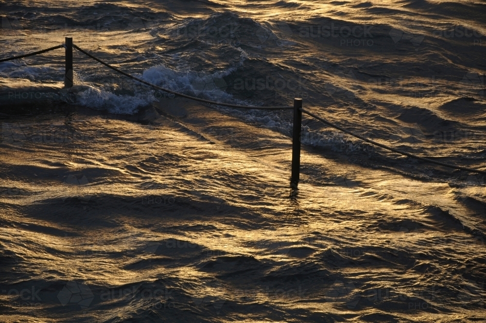 Golden light over ocean - Australian Stock Image