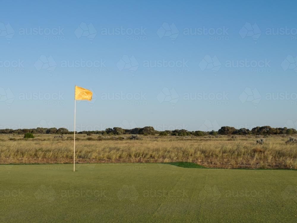 Golf putting green on the Nullarbor Plain with a big blue sky - Australian Stock Image