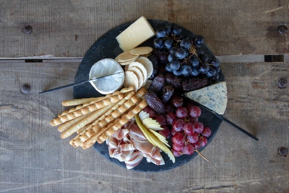 Gourmet Grazing Platter on Rustic Table - Australian Stock Image