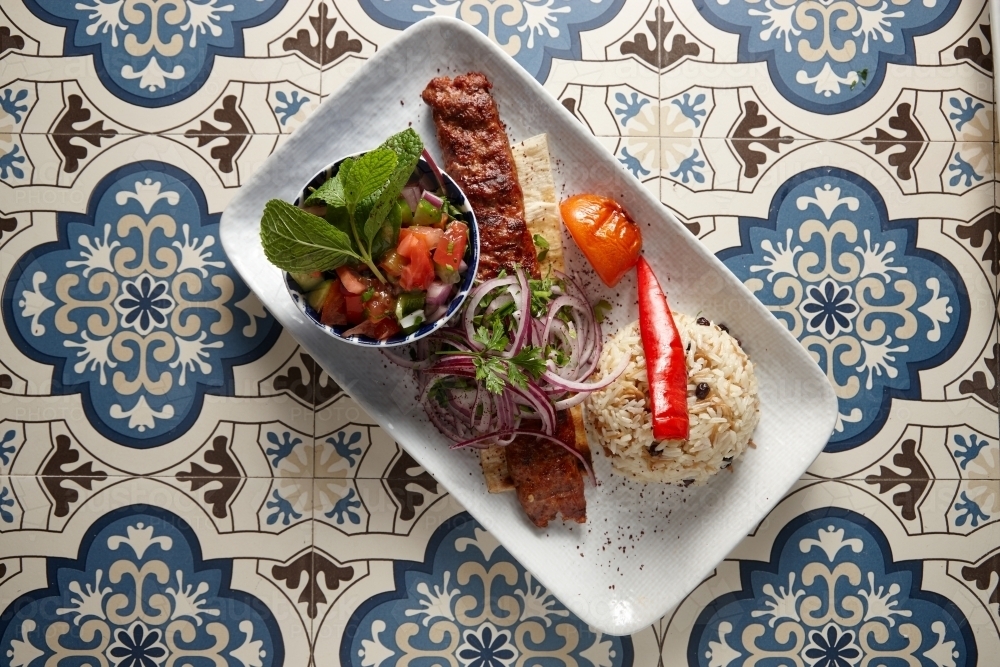 Gourmet Lebanese kebab and salad on plate - Australian Stock Image